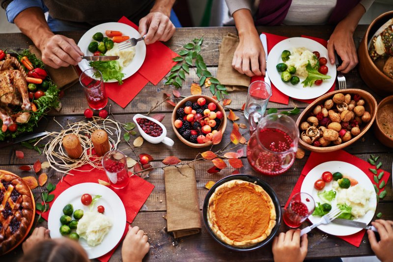 Group of friends eating display of holiday foods