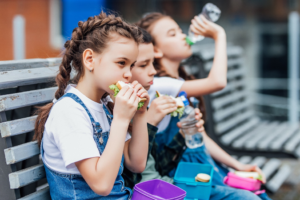 a child eating lunch at school 