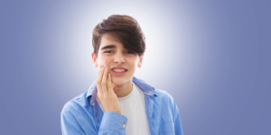 a patient with braces dealing with mouth discomfort 